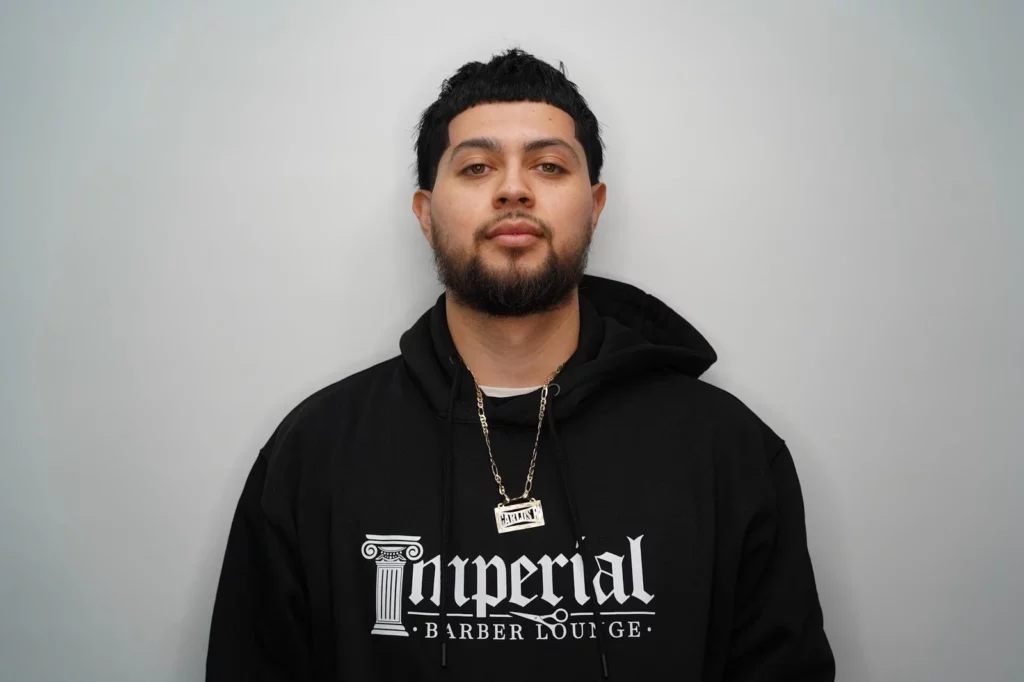 Headshot of Carlos, a barber of Imperial Barber Lounge's St. Paul location