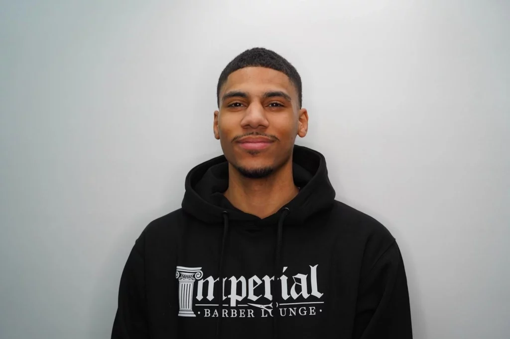 Headshot of Chase, a barber of Imperial Barber Lounge's St. Paul location