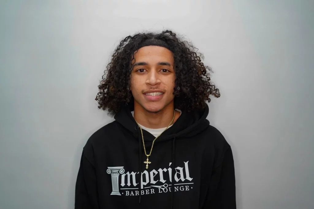 Headshot of Dre, a barber of Imperial Barber Lounge's Coon Rapids location