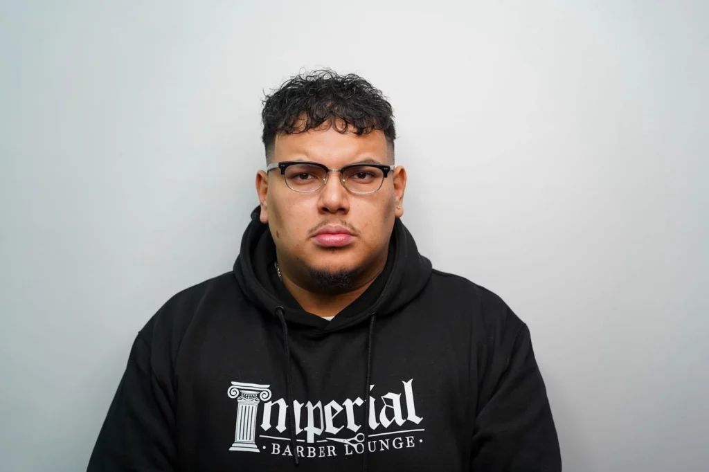 Headshot of Greg, a barber of Imperial Barber Lounge's St. Paul location