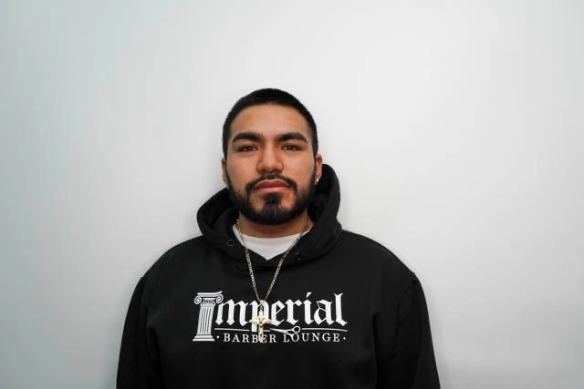 Headshot of Jonathan, a barber at imperial barber lounge