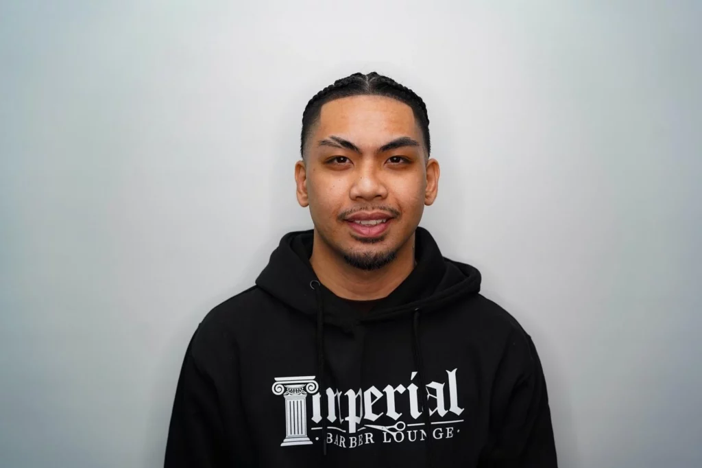 Headshot of Kai, a barber of Imperial Barber Lounge's Coon Rapids location