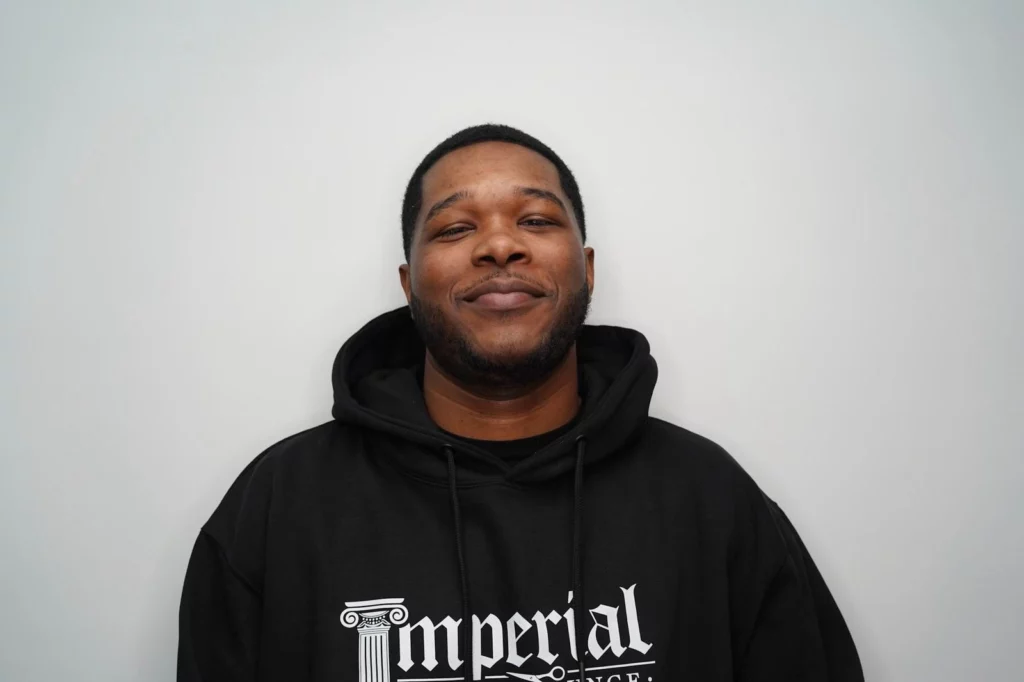 Headshot of Thomas, a barber of Imperial Barber Lounge's St. Paul location